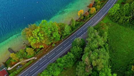 Aerial-top-down-drone-view-of-an-empty-lakeshore-road-in-Lake-Attersee