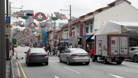 Traffic-Stopping-At-Pedestrian-Crossing-Along-Serangoon-Road-In-Little-India-With-Diwali-Decorations-Hanging-Between-Lampposts-During-The-Day