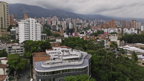 Medellin-Colombia-Aerial-v3-low-drone-flyover-Manila,-Lalinde-and-El-Poblado-upscale-neighborhoods-capturing-street-traffics-and-hillside-high-rise-cityscape---Shot-with-Mavic-3-Cine---November-2022