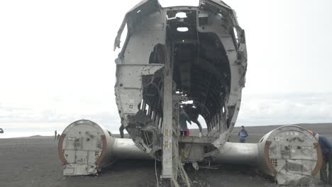 Tourists-explore-iconic-US-Navy-DC-3-wreckage-in-remote-Icelandic-landscape