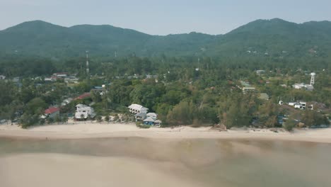 Stunning-drone-footage-of-the-resorts,-mountains-and-beautiful-beach-along-Koh-Phangan-Thailand