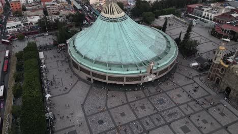 Panoramic-drone-video-showcasing-the-Basilica-of-Guadalupe,-a-revered-pilgrimage-site