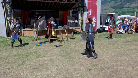 A-sword-fighting-scene-performed-by-Burdyri,-a-professional-sword-and-stage-combat-team,-during-the-South-Tyrolean-Medieval-Games