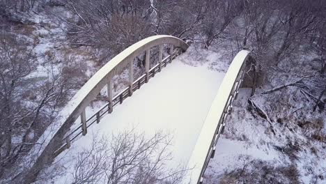 Monochrome-winter-scene:-Aerial-view-of-abandoned-old-highway-bridge
