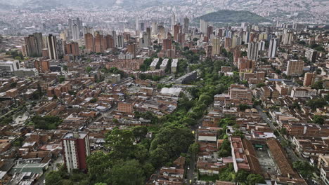 Medellin-Colombia-Aerial-v54-flyover-Caicedo,-Boston-and-Los-Angeles-capturing-La-Candelaria-cityscape,-panning-views-of-hillside-Comuna-8-and-Villa-Hermosa---Shot-with-Mavic-3-Cine---November-2022