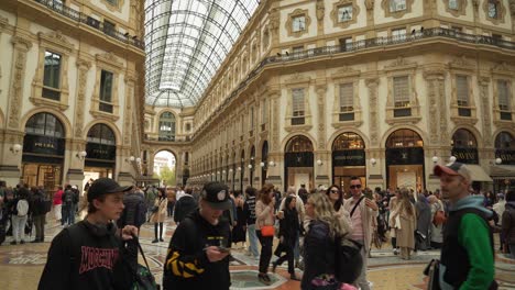 Couple-Taking-Selfies-in-Galleria-Vittorio-Emanuele-II-in-Front-of-Prada-and-Louis-Vuitton-Shops