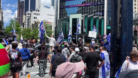 Protestors-hold-flags-and-gather-in-support-of-Israel-on-a-downtown-street