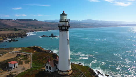 Aerial-view-passing-the-Walton-Lighthouse,-sunny-day-in-Santa-Cruz,-CA,-USA