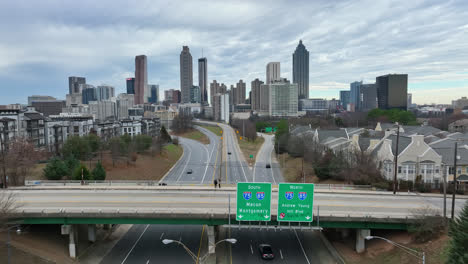 Aerial-flyover-of-Jackson-street-bridge-with-the-atlanta-skyline-in-the-background