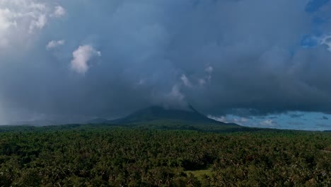 Drone-Reveal-of-Paco-Volcano-Amidst-Stormy-Skies-in-Mainit,-Philippines