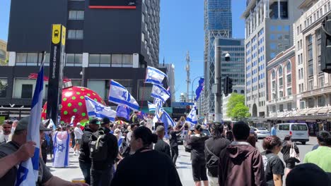 Crowd-of-demonstrators-gather-on-street-in-support-of-Israel,-Auckland