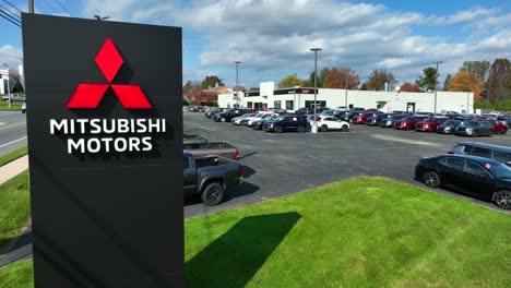 Mitsubishi-Motors-logo-and-sign-at-car-dealership-in-USA