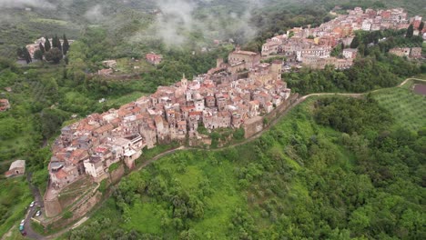 San-Gregorio-da-Sassola-aerial-along-town-sitting-in-the-clouds,-Italy