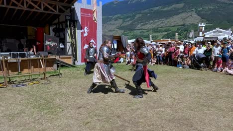 A-fighting-scene-with-weapons-performed-by-Burdyri,-a-professional-sword-and-stage-combat-team,-during-the-South-Tyrolean-Medieval-Games-2023