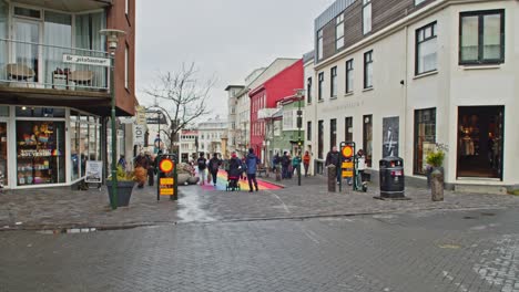 Wide-view-of-Rainbow-street-in-central-Reykjavik-with-Tourists-walking-around