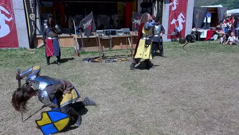 A-fighting-scene-with-weapons-performed-by-Burdyri,-a-professional-sword-and-stage-combat-team,-during-the-South-Tyrolean-Medieval-Games-2023