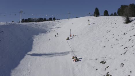 Pull-Away-Drone-Shot-of-Ski-slope-in-a-German-ski-resort