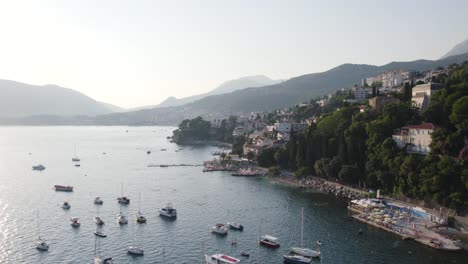 Aerial-establisher-beautiful-coast-city-Herceg-Novi-in-Montenegro-on-sunrise