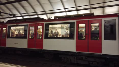 A-Red-and-White-Train-Wagon-Travels-the-Barcelona-Metro-Underground-Station