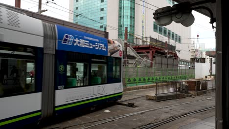 Green-Mover-Max-Light-Rail-Vehicle-Departing-Platform-At-Hiroshima-Station-In-Japan