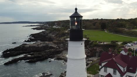 Beautiful-Lighthouse-On-Maine-Coastline,-Parallax-Aerial-Shot