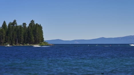 Boats-entering-and-leaving-Emerald-Bay,-Lake-Tahoe,-California---time-lapse