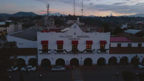 A-drone-captures-a-stunning-view-of-the-splendid-architecture-of-Amoloya-town,-giving-a-cinematic-look-over-the-buildings-at-evening-time-in-Ecatepec-de-Morelos,-Mexico