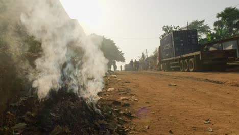 Kumasi,-Ghanaplastic-waste-burning-in-street-corner-of-africa-town-city-pollution-concept