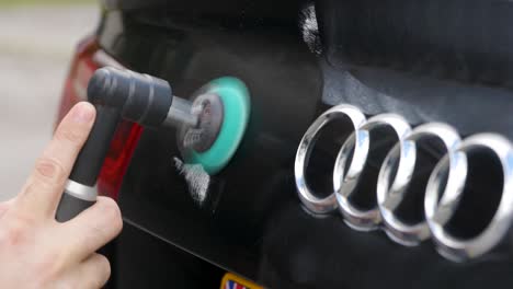 Polishing-a-black-car-trunk-boot-with-a-small-machine-polisher