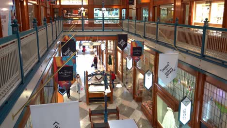 View-from-second-floor-capturing-the-interior-of-Brisbane-arcade-and-shoppers-shopping-at-designer-boutiques-at-fashion-laneway,-Queen-street-mall