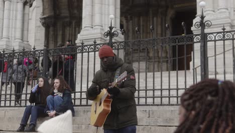 Black-man-playing-guitar-on-the-street