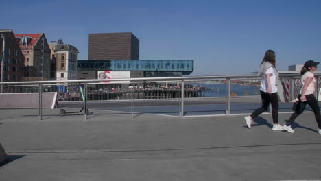 Pedestrians-walking-across-a-bridge-in-urban-Copenhagen