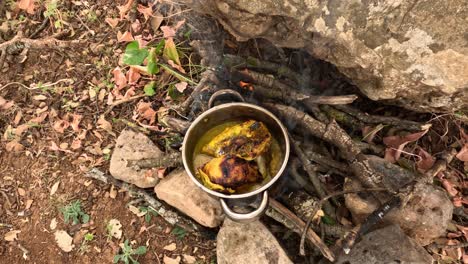 The-age-old-tradition-of-cooking-chicken-in-a-pot-over-open-wood-fire