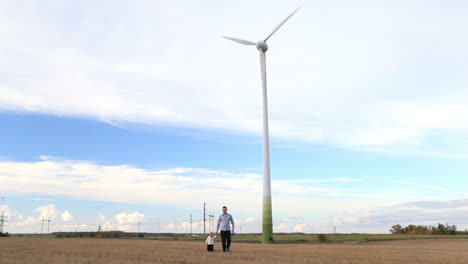 Father-and-son-near-the-wind-turbine