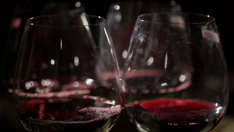 Red-wine-is-poured-in-the-glasses
