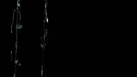 Two-water-jets-on-black-background-Macro-shot
