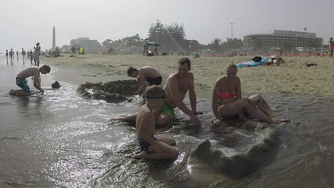 Family-making-sandcastle-on-the-beach-Vacation-in-Gran-Canaria-Spain
