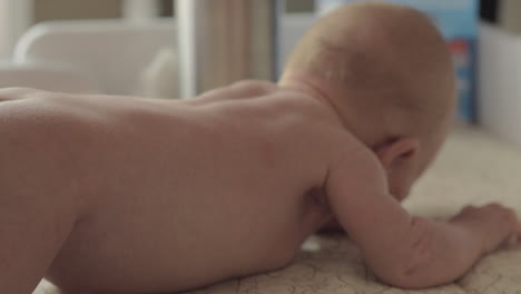 Nude-baby-girl-on-changing-table-at-home