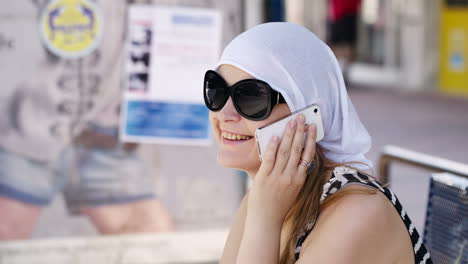 Woman-in-a-headscarf-chatting-on-mobile