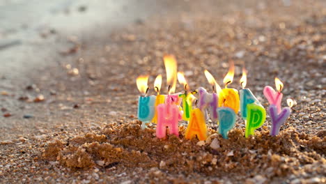 Birthday-candles-burning-on-a-seashore