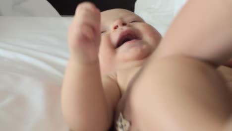 Baby-laughing-when-mother-making-massage