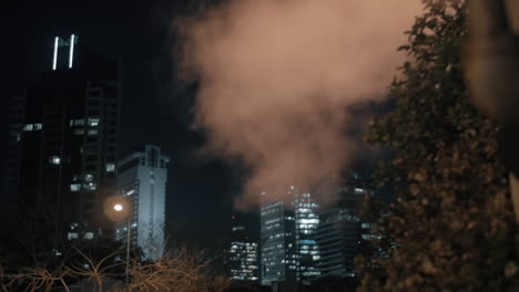 Night-cityscape-with-condensing-steam-Tel-Aviv