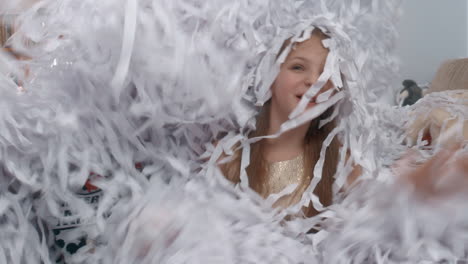 Children-having-fun-in-heap-of-paper-confetti