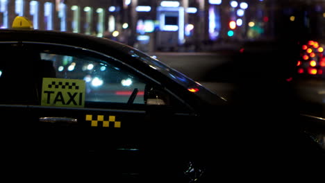 Timelapse-of-city-traffic-at-night-behind-taxi-car