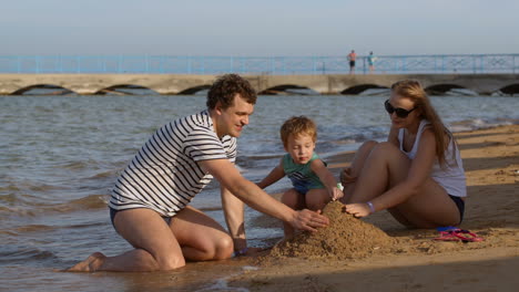 Family-making-a-sandcastle