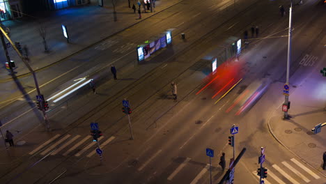 Timelapse-of-night-city-traffic-in-Tallin-with-pedestrians-and-public-transport