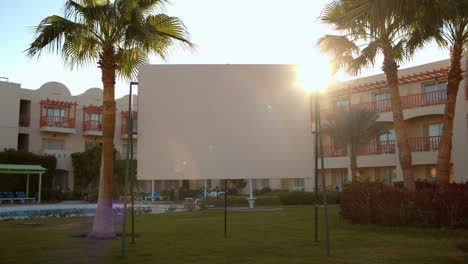 Sun-flare-behind-a-blank-urban-billboard