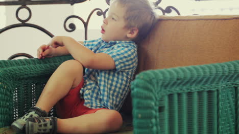 Boy-sitting-in-the-armchair