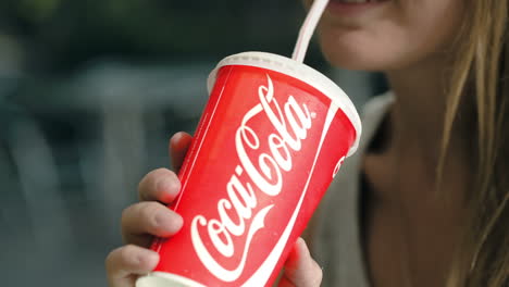 Woman-drinking-Coca-Cola