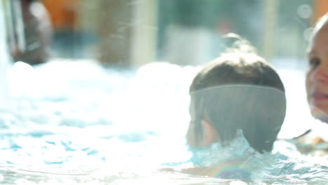 Boy-in-the-swimming-pool-splashing-water